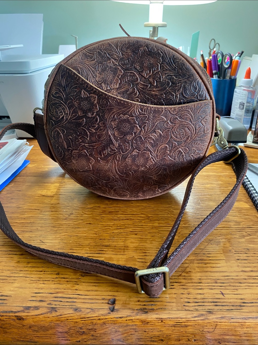 Hand-Tooled Floral Round Crossbody Bag in Brown
